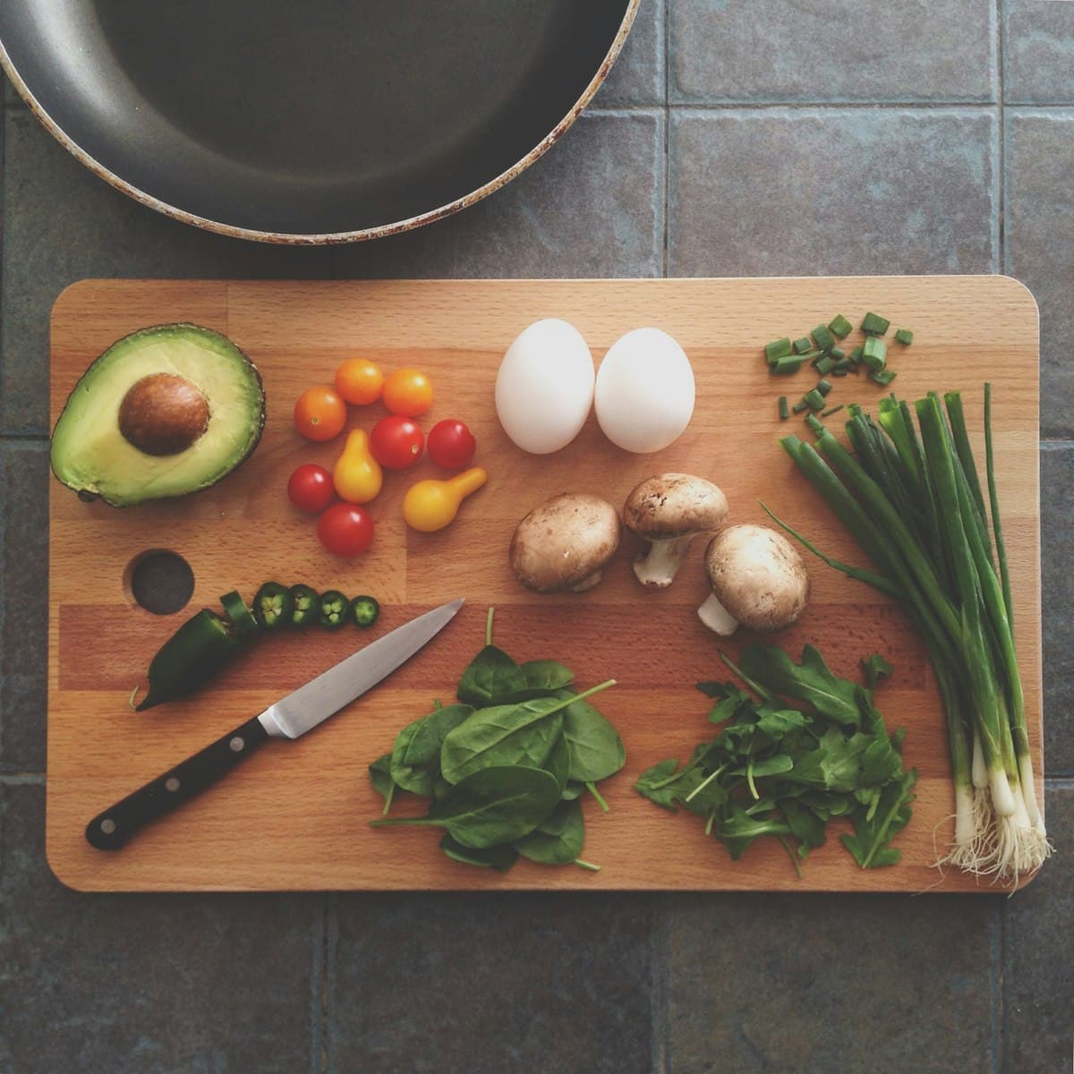 Chef hands slicing fresh herbs